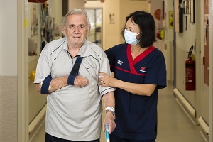 Staff member assisting a patient