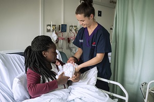 Staff member with a maternity patient