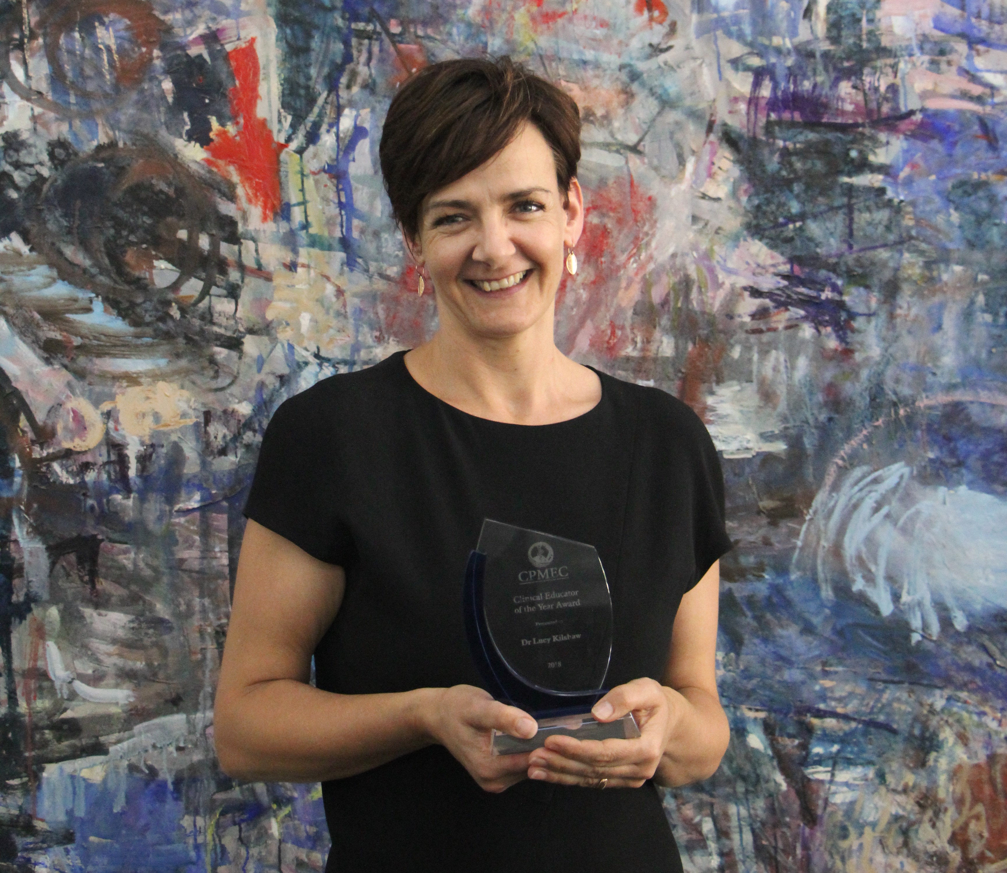 Photo of Dr Lucy Kilshaw with her award